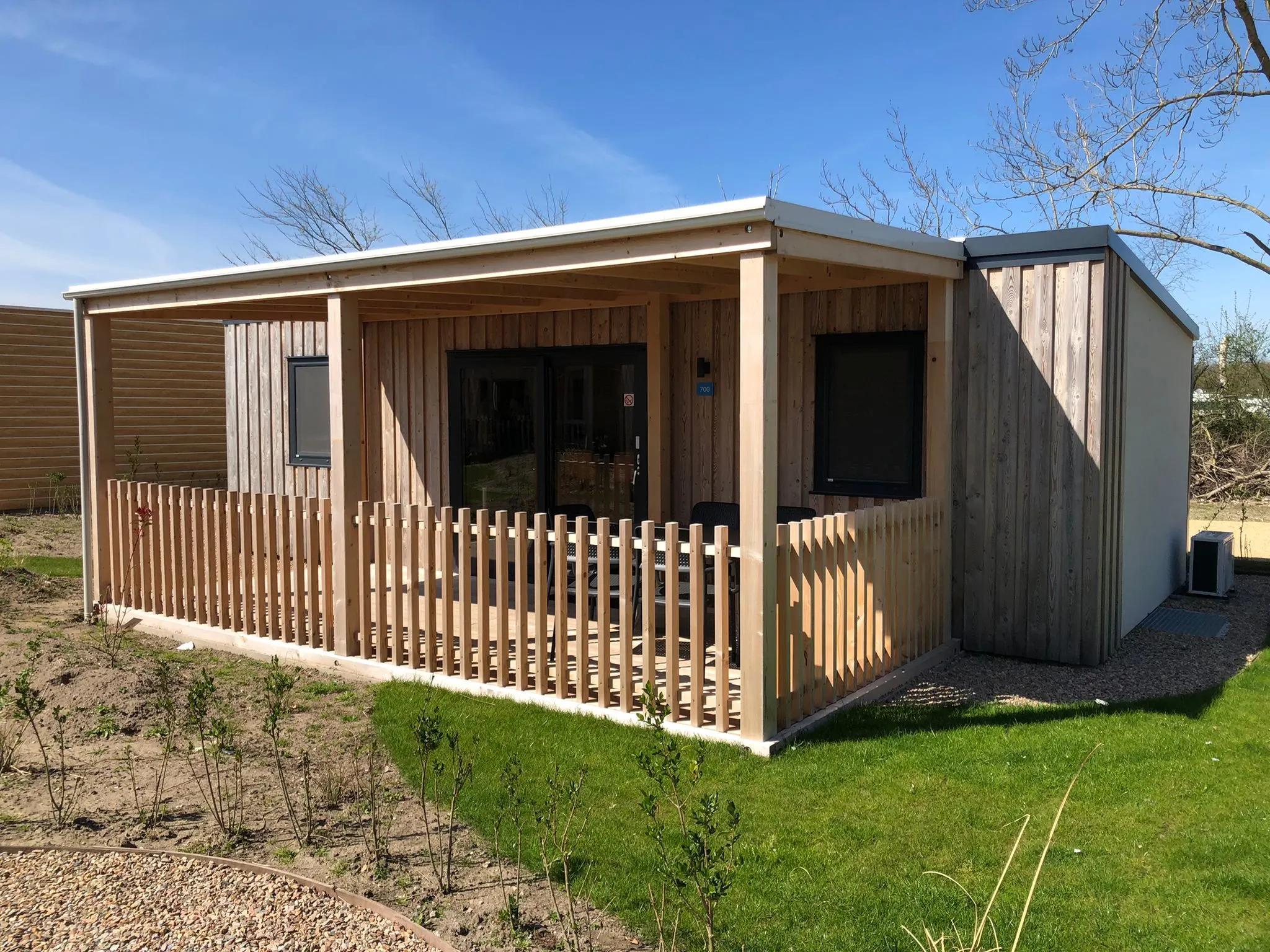 Wooden chalet with terrace at Veluwe Lake