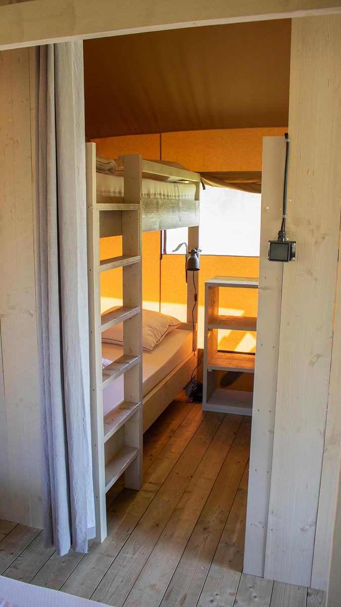 Luxury glamping tent in a family campground