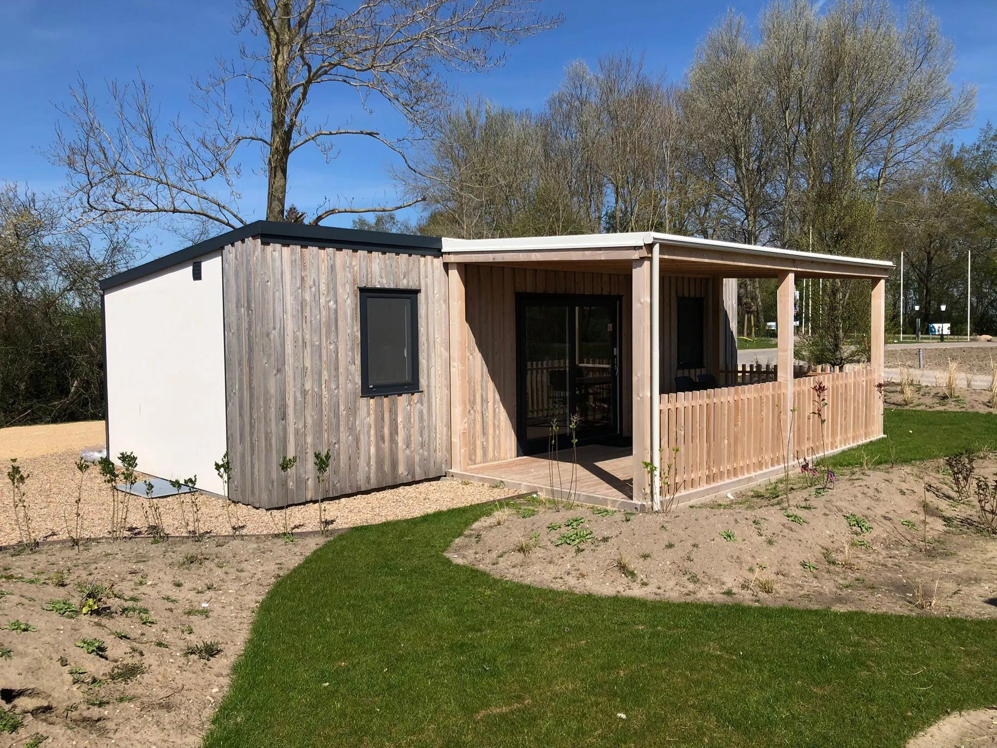 Wooden chalet with terrace at Veluwe Lake