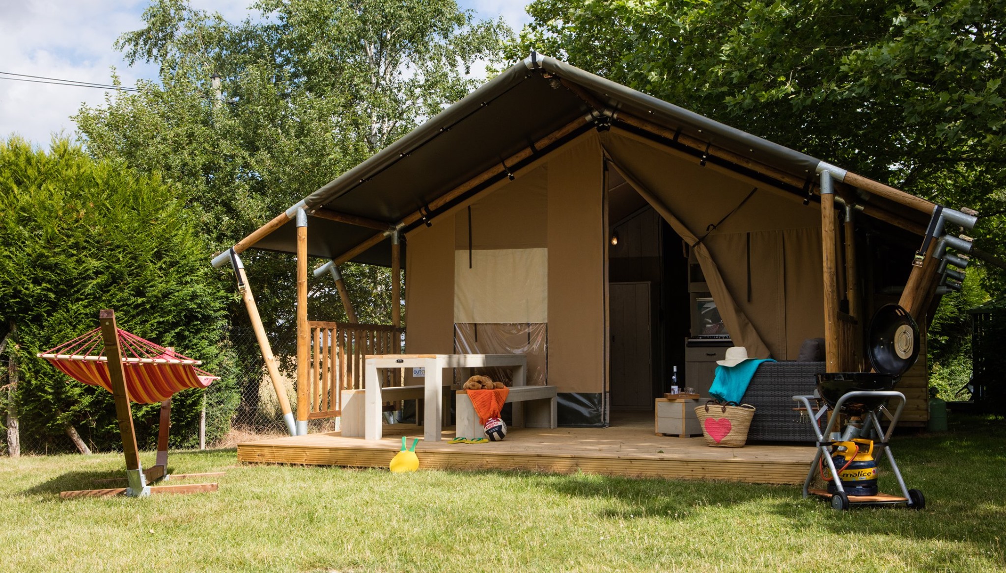 Luxury glamping tent in a family campground